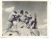 PHOTO SHOWING RECOVERY OF WOUNDED TANK CREW